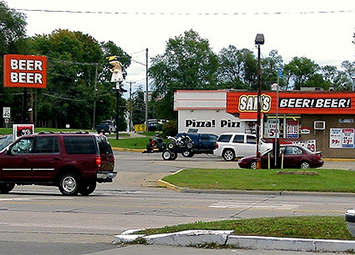 A beer outlet in Michigan, multiple signs reading BEER BEER